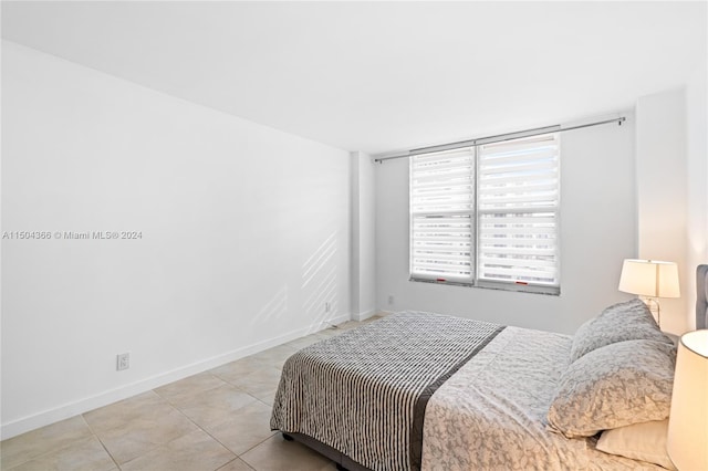 bedroom featuring light tile patterned floors