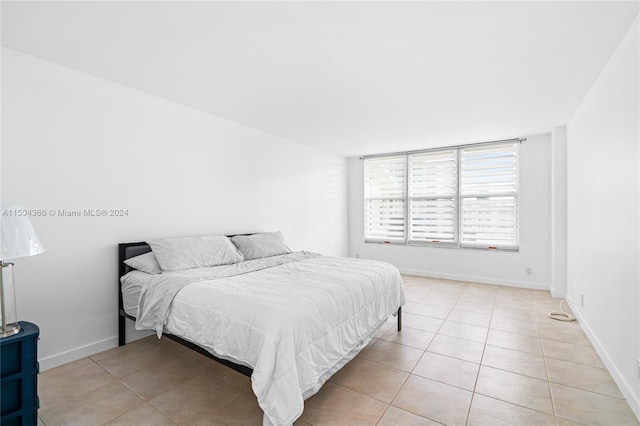 bedroom featuring light tile patterned floors