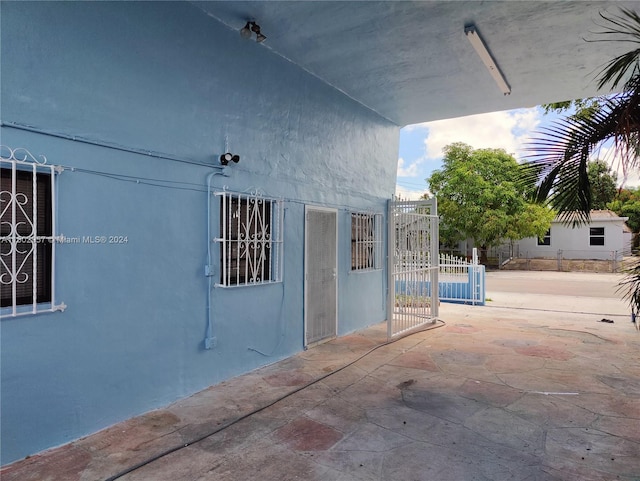 doorway to property featuring a patio