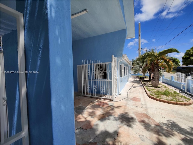 view of side of property featuring a patio area