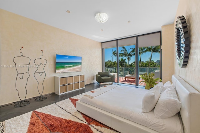 bedroom with access to exterior and floor to ceiling windows