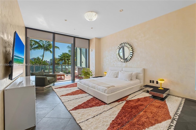 tiled bedroom featuring access to exterior and floor to ceiling windows