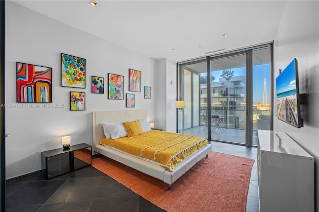 tiled bedroom featuring a wall of windows and access to outside