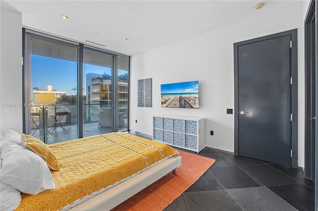 tiled bedroom with access to exterior and floor to ceiling windows