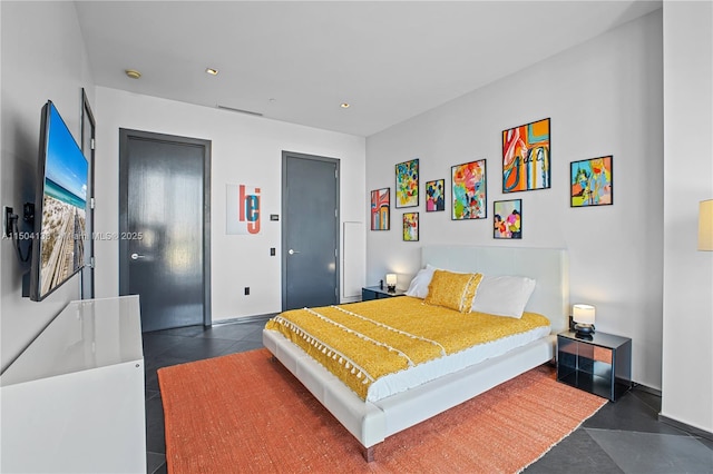 bedroom featuring dark tile patterned flooring