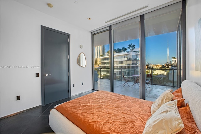 bedroom featuring a wall of windows and access to outside