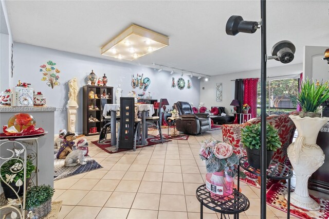 misc room with rail lighting and light tile patterned floors