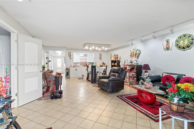 living room featuring track lighting and light tile patterned floors