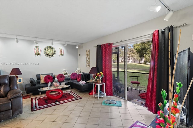 living room with rail lighting and light tile patterned flooring