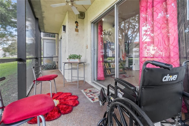 sunroom featuring a ceiling fan