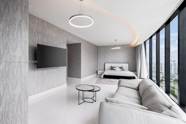 bedroom with tile floors and a wall of windows