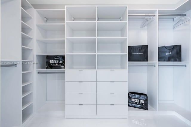 spacious closet featuring tile floors