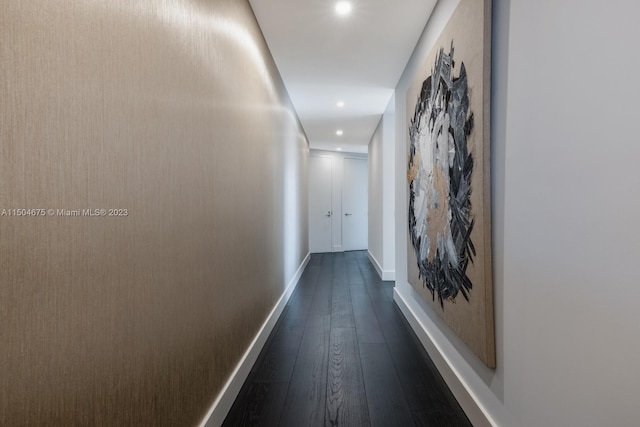 corridor featuring dark hardwood / wood-style flooring