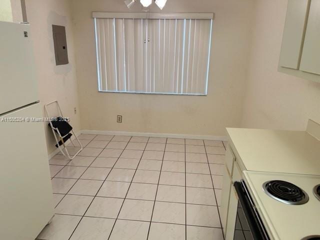 unfurnished dining area featuring light tile patterned floors and electric panel