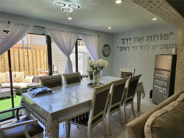 tiled dining room with plenty of natural light