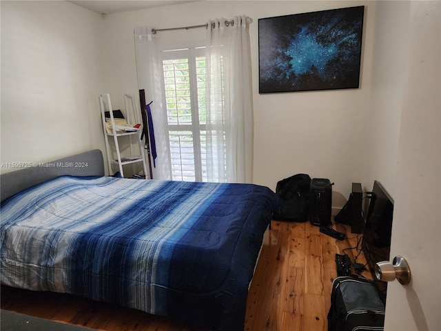 bedroom featuring hardwood / wood-style floors