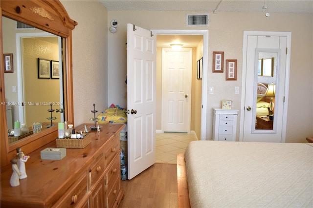 bedroom with light hardwood / wood-style flooring