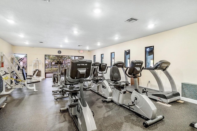 workout area with a textured ceiling