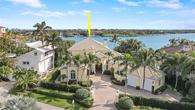 birds eye view of property with a water view