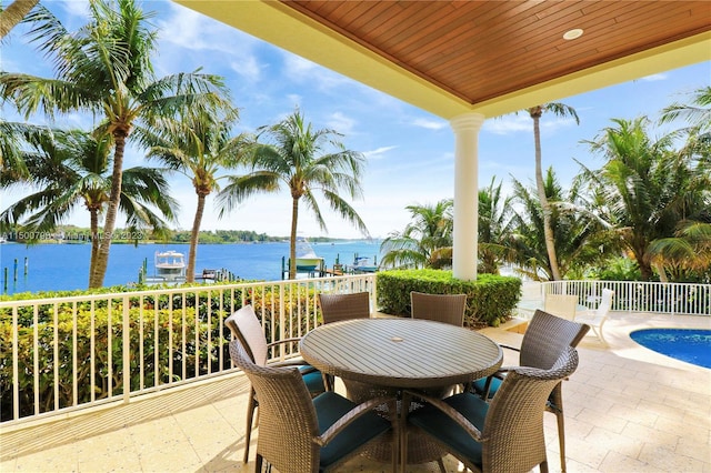 view of patio with a water view