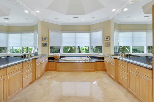 bathroom with vanity, tile floors, a bath to relax in, and a wealth of natural light