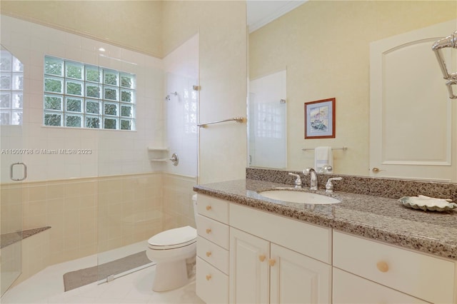 bathroom with toilet, an enclosed shower, vanity, and crown molding