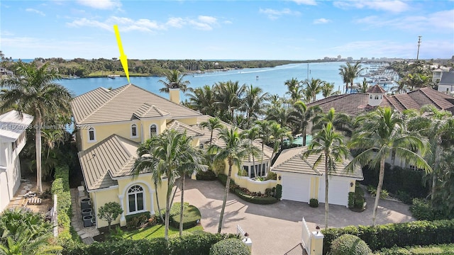 birds eye view of property featuring a water view