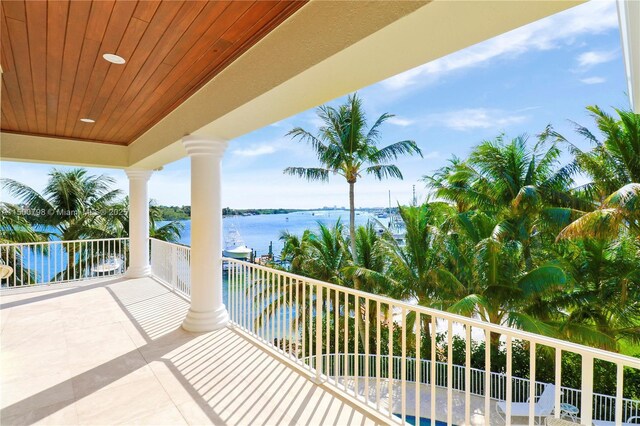 balcony featuring a water view