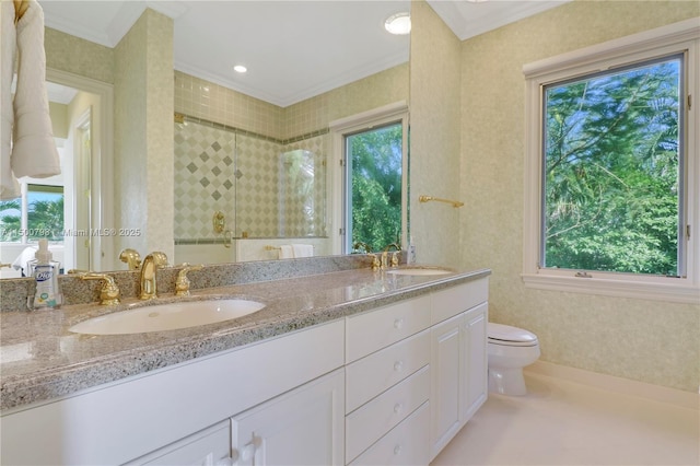 bathroom with ornamental molding, toilet, vanity, and walk in shower