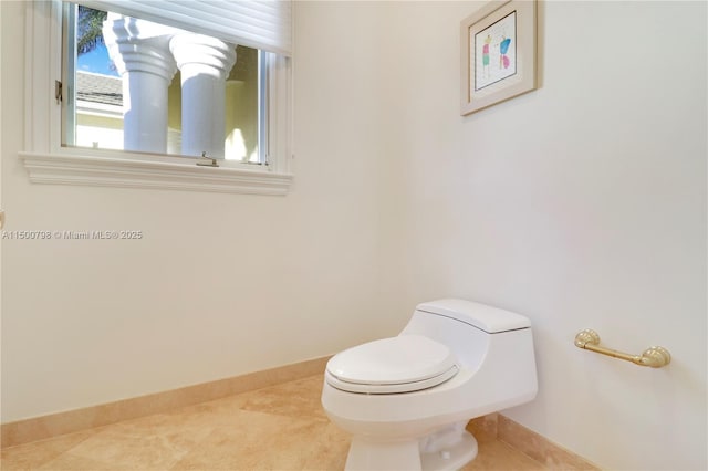 bathroom featuring tile patterned floors and toilet