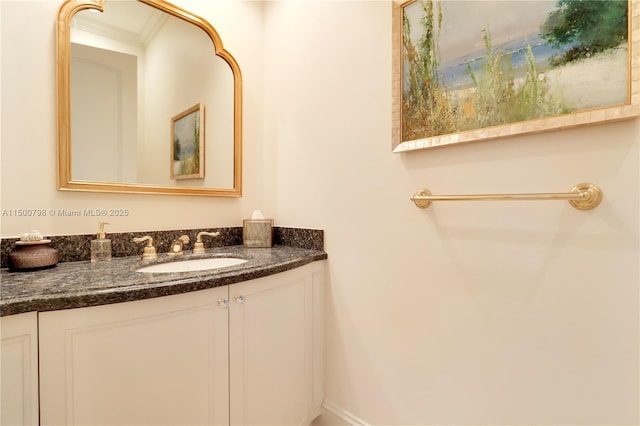 bathroom featuring vanity and ornamental molding