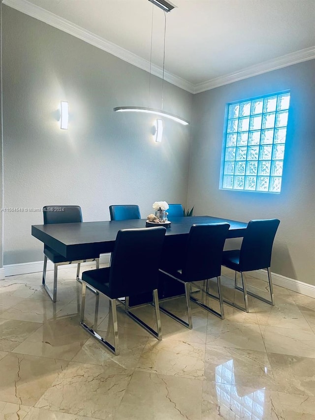 dining space featuring ornamental molding