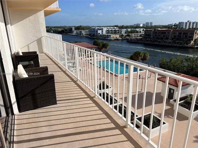 balcony featuring a water view