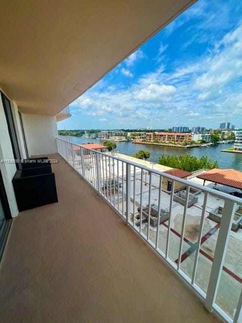 balcony featuring a water view