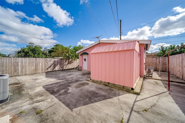 854 E 24th St, Hialeah, FL 33013 - view of shed featuring a fenced backyard and central AC unit