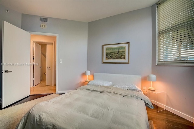 bedroom with light wood-type flooring