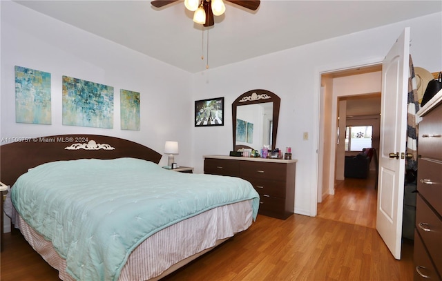 bedroom featuring wood-type flooring and ceiling fan