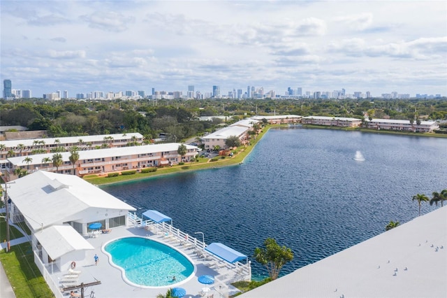 birds eye view of property with a water view