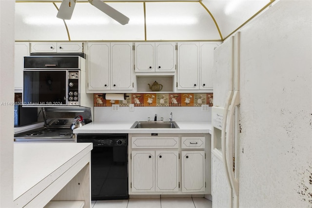 kitchen featuring sink, white refrigerator with ice dispenser, light tile patterned floors, dishwasher, and range