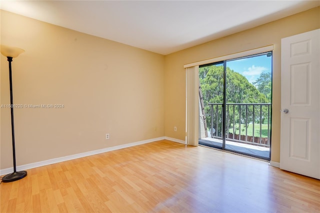 empty room with light hardwood / wood-style floors