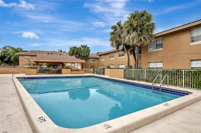 view of swimming pool with a patio area