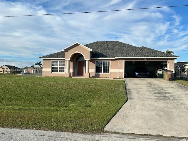 ranch-style house featuring a garage and a front yard