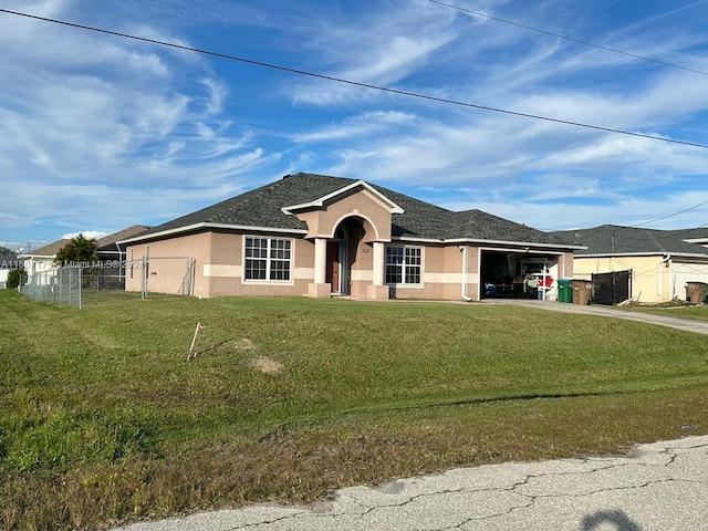 single story home featuring a garage and a front lawn