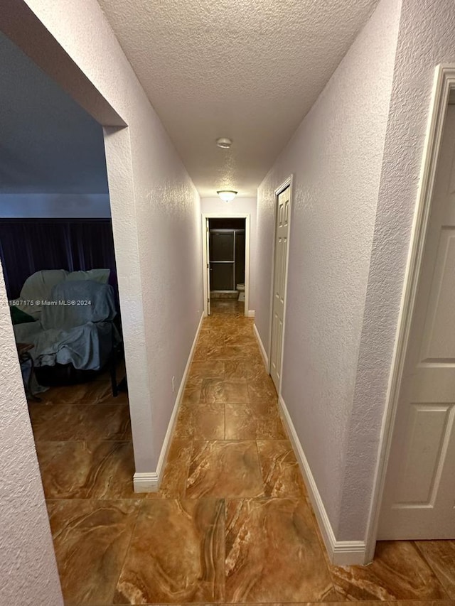 corridor with tile patterned floors