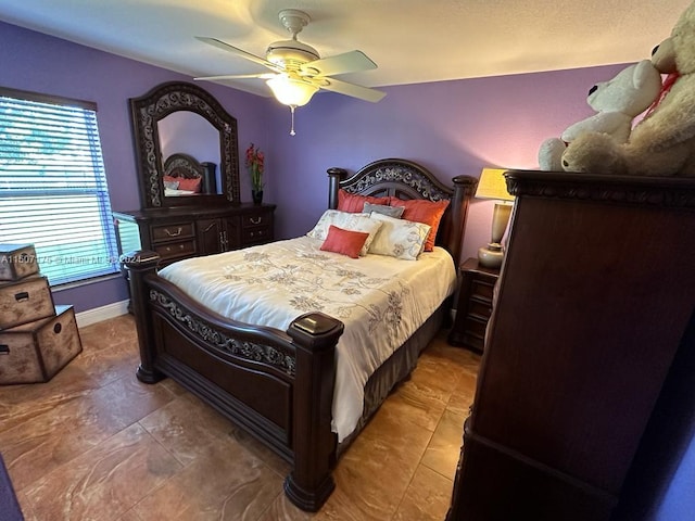 tiled bedroom with ceiling fan