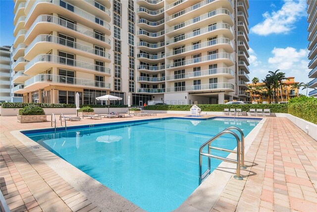 community pool with a patio