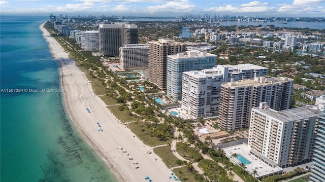 aerial view featuring a view of the beach and a water view