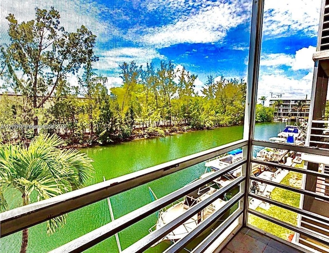 balcony featuring a water view