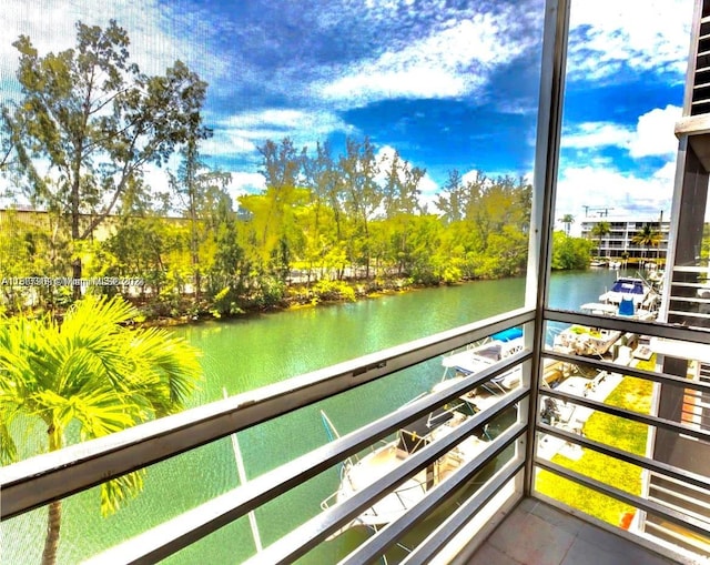 balcony featuring a water view