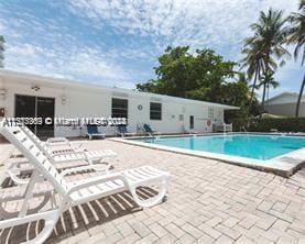 view of swimming pool with a patio area